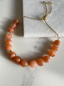 Peach Sunstone Bracelet with Gold Beads & Adjustable Slider Fastening